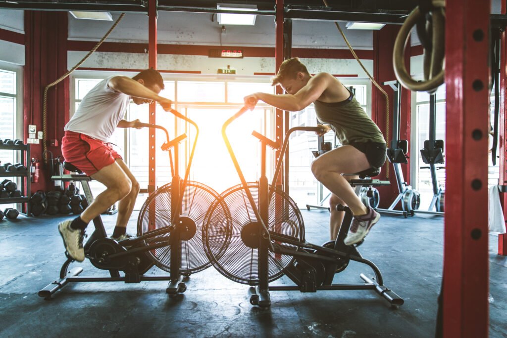 Muscular athletes training in a crossfit gym - functional training exercise in a gym