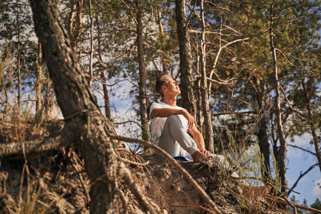 A person who practices meditation in nature to promote mental health.